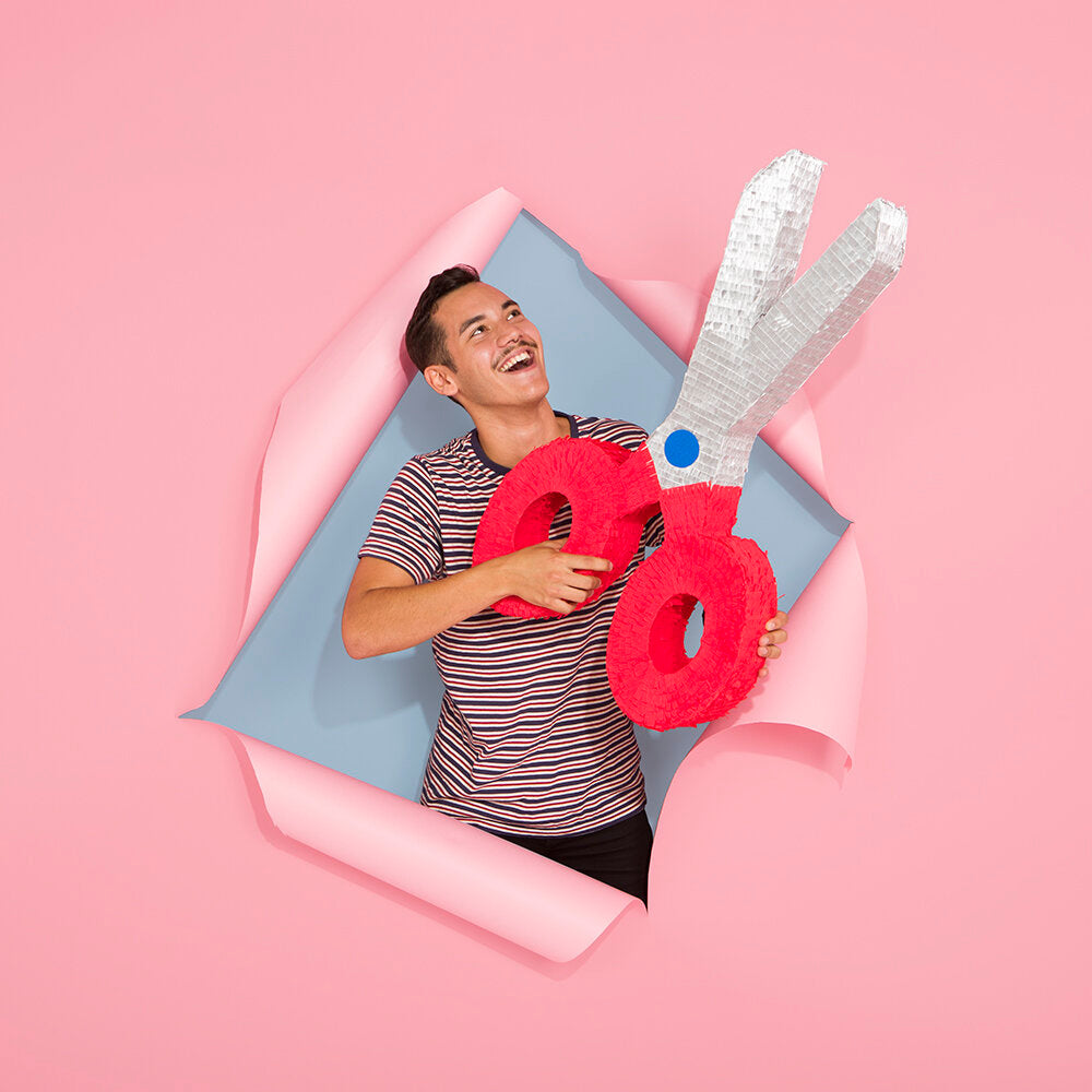 Spread from Kitiya Palaskas' Pinata Party book featuring a scissor pinata