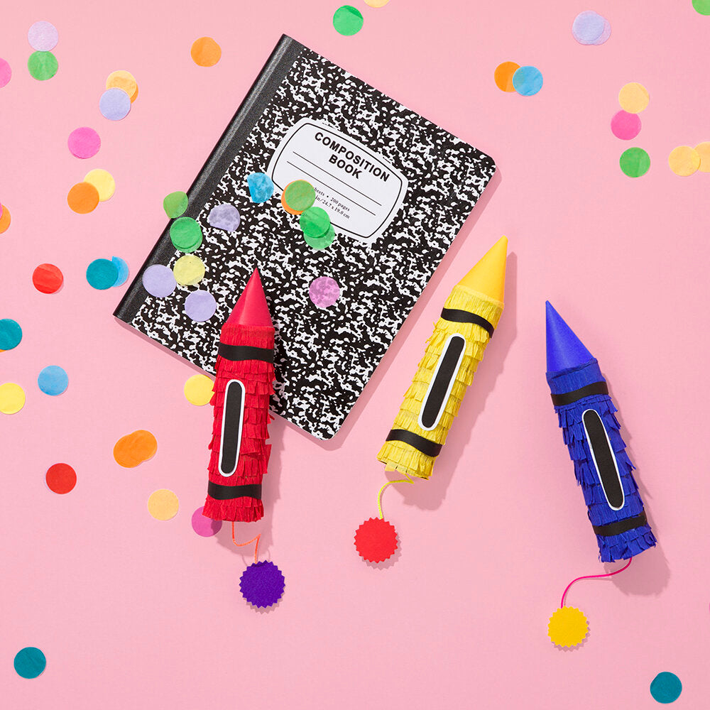 Spread from Kitiya Palaskas' Pinata Party book featuring pencil pinatas on a pink background